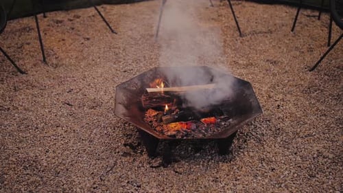 Backyard fire pit in a rocky, outdoor space