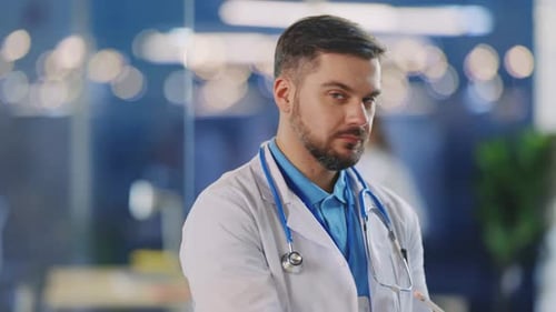 Confident Doctor Looking at Camera in Modern Hospital