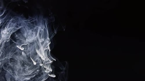 Swirling Wispy White Ink on Dark Black Background