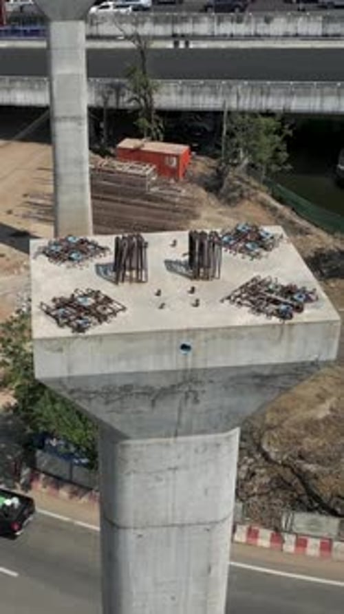 View From the Top of a Girder with Cars Driving Underneath It