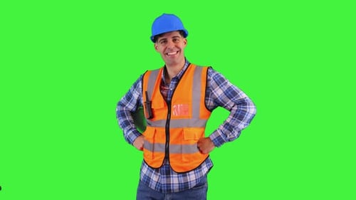 Smiling Construction Worker Poses Against Green Screen