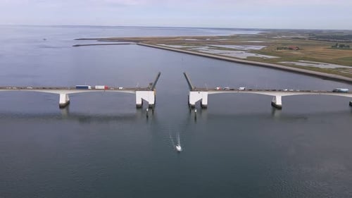 birds eye view over the open zeeland bridge in the netherlands with a passing boat
