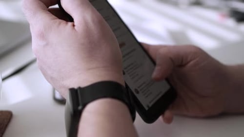 Man scrolling social media in smartphone