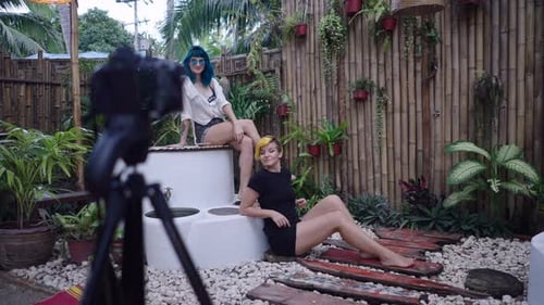 Influencer Women Stand Still for Photoshoot in Beautiful Garden Slow Motion Shot