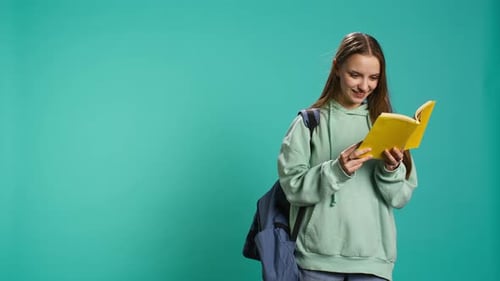 Young Girl Reading Book Enjoying Hobby Being Entertained