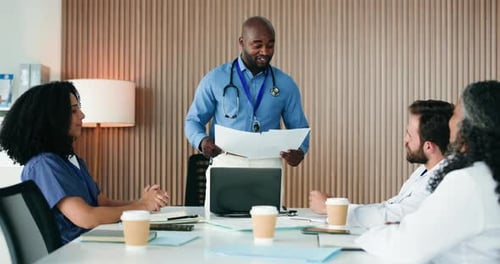 Man, team and doctors at meeting, documents and discussion with report for workshop at hospital