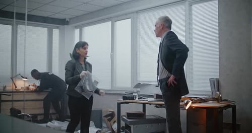 Detectives Reviewing Evidence in Office