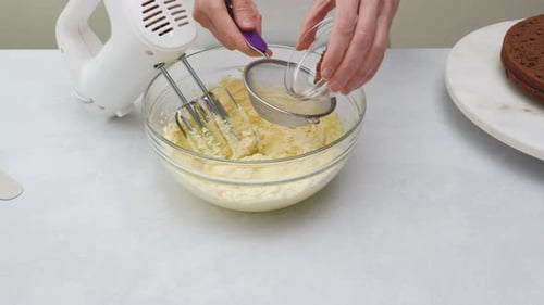 Adding Cocoa Powder to Baking Mixture at Home