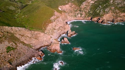 Enjoy an Aerial View of Serene Coastal Cliffs Along with the Beautiful Turquoise Waters