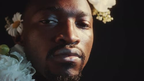 Close-Up Portrait of Handsome Black Man with Flower Wreath