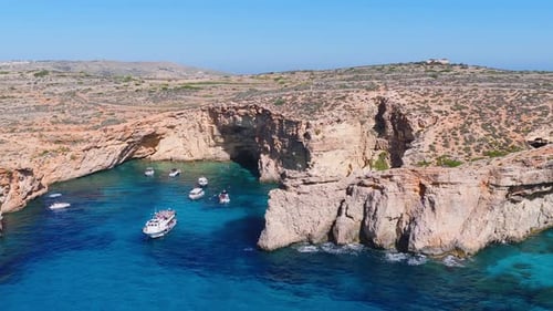 Aerial Panorama of Comino Blue Lagoon Malta with Boats and Caves
