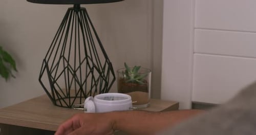 Man Wakes Up and Turns Off Alarm Clock