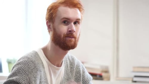 Smiling Man Gives Okay Hand Gesture and Winks