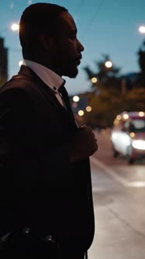 Night Lifestyle Tired African American Businessman with Bag Passing Road Against Cars Going Home