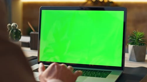 Unknown Worker Scrolling Touchpad Green Screen Laptop at Modern Workplace Close Up