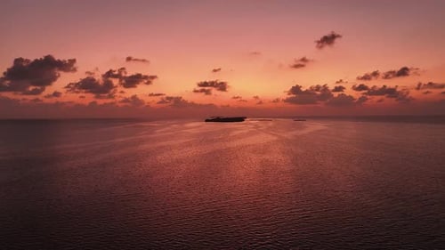Aerial view of sunset over the ocean, Maldives.