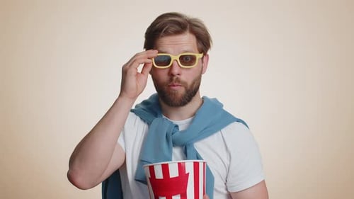 Man Watching Movie Eating Popcorn