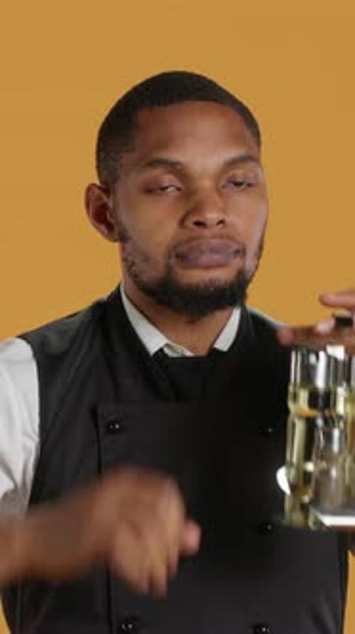 Vertical Video Restaurant Staff Giving a Thumbs Down Sign Against Yellow Background