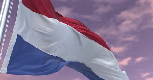 Netherlands Flag Waving Realistically Against a Clouded Sky