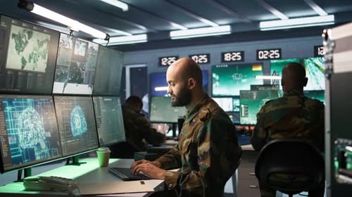 Military Man Working at Computer in Control Room