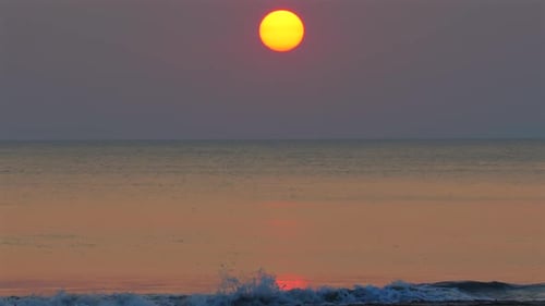 Serene Ocean Sunset with Vibrant Colors Reflecting on Calm Water