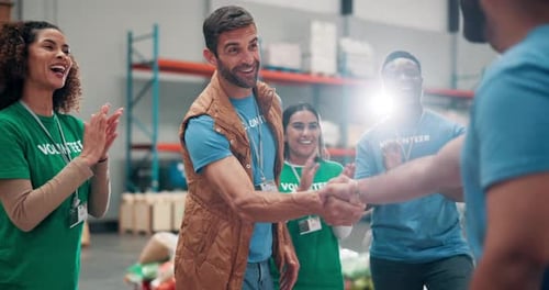 Enthusiastic Volunteers Celebrate in Warehouse