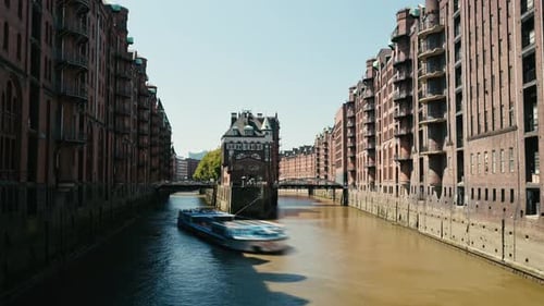 Time Lapse of the Center of Hamburg with a Boat Floating on the River