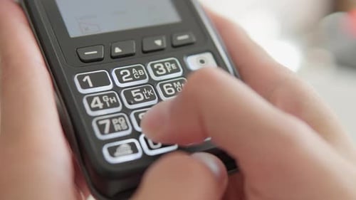 The Seller is a Business Owner Holding a Bank POS Terminal The Cashier Enters the Amount of Payment