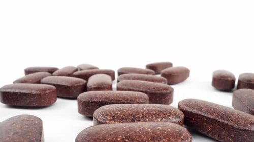 Close Up of Brown Oblong Tablets