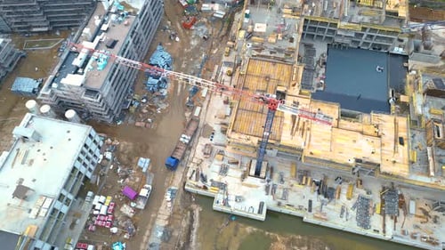 Aerial Flight Over a New Constructions Development Site. Urban Construction Site, Aerial View. High