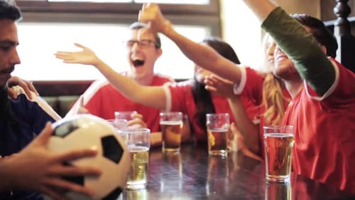 Friends at the Pub Enjoying Sporting Event
