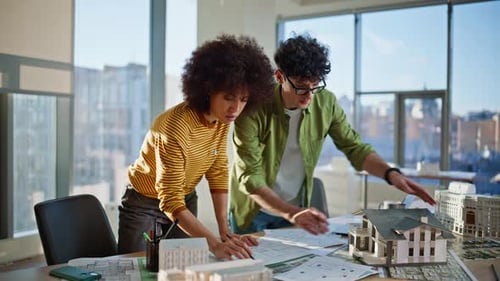 Colleagues Planning Building Design at Real Estate Agency Office Two Architects