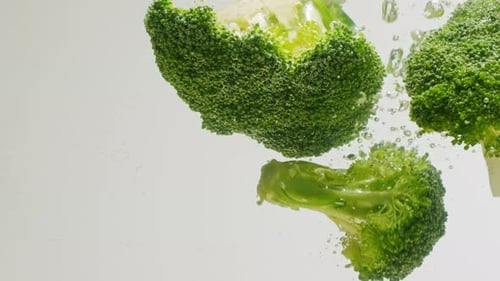 Green Broccoli Falling in Boiling Water Fresh Fruits and Vegetables Falling Splashing Into Water