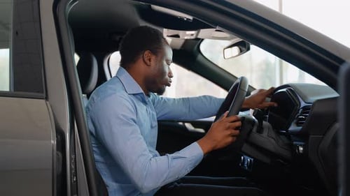 Excited Customer Admires of Advantages of New Electric Car in Showroom Right Hand Drive Car