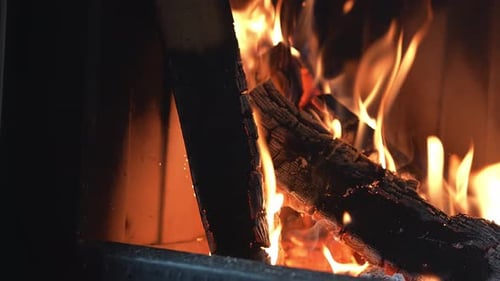 Close Up of Crackling Fireplace with Flickering Flames in Motion