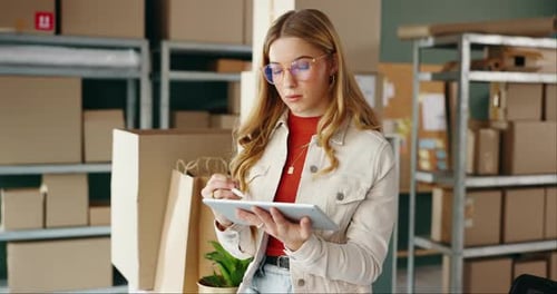 Woman Using Tablet in Shipping Warehouse