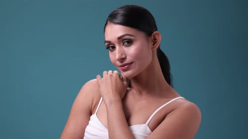 Beautiful Young Woman Smiling and Posing in Studio
