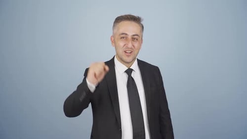 Excited Businessman Celebrates Success in Studio