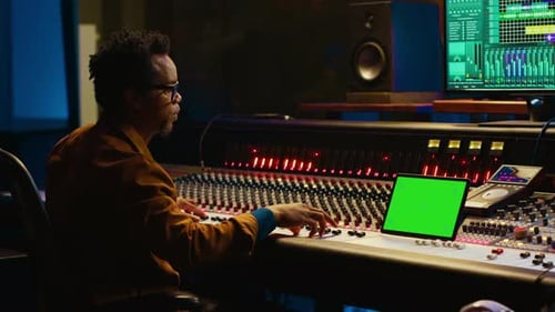 Sound Engineer Expert Recording Audio Tracks Next to Tablet Mockup