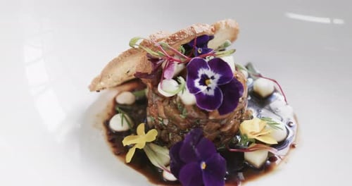 Exquisite Food Presentation with Edible Flowers and Bread