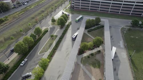 Bus station, early morning light, follows bus leaving station. depot.