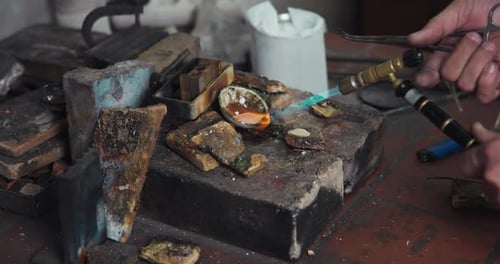 Jeweler Melts Silver with a Gas Burner in a Jewelry Workshop