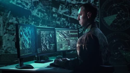 Military Soldier Operating Advanced Technology in a Command Center