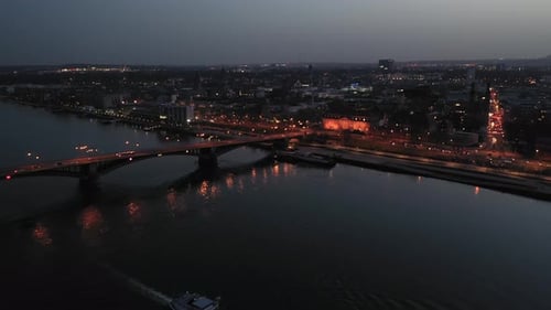Approaching drone flight by night over Mainz right after magic hour on a warm spring day showing the