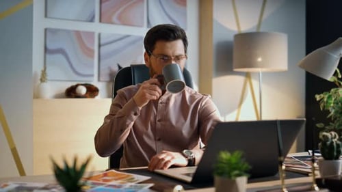 Busy Manager Drinking Coffee at Office Work Close Up Worker Looking at Laptop