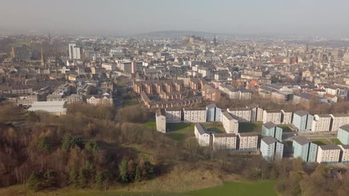 Aeriel view with a left to right pan across Edinburgh city on a sunny day, Scotland. Taken from from