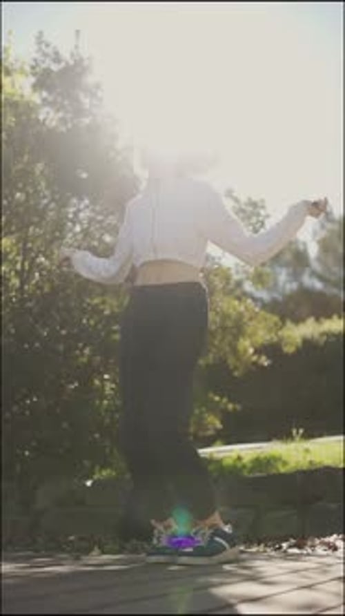 Young Woman Jumping Rope in a Park