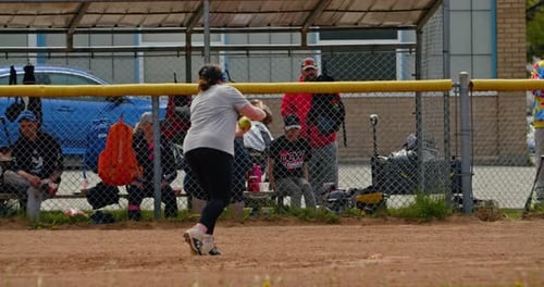 Friends Playing Baseball at a Halifax Beach Park