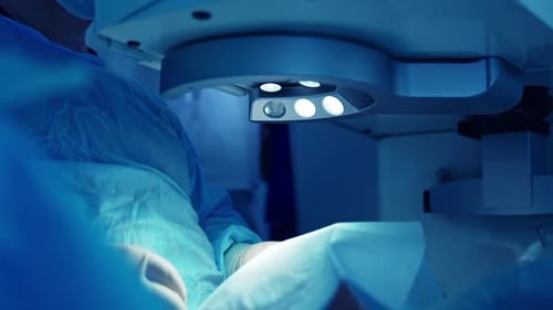 Surgeon Performing Delicate Operation Under Bright Lights