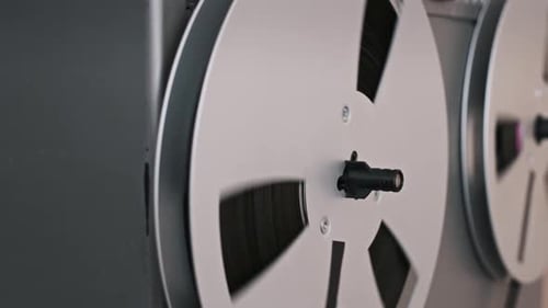 Vintage Reel-to-Reel Tape Recorder Spinning Close Up